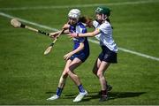 25 June 2022; Eabha Kelly of Killeedy in action against Eva Ní Fhloinn of Athenry during the John West Féile na nGael National Camogie and Hurling Finals, 2022 at the GAA National Games Development Centre Campus, Abbotstown today. Eighty club sides from Ireland, the UK, Europe and US competed in the final stages of the under-15 competition across 10 venues in Dublin and Meath. Sponsored for the seventh time by John West, it is one of the biggest underage sporting events on the continent. Photo by David Fitzgerald/Sportsfile