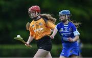 25 June 2022; Sarah Brogan of Na Fianna, Meath in action against Katie Colgan of Tullamore, Offaly, during the John West Féile na nGael National Camogie and Hurling Finals at Kiltale GAA in Meath. Photo by Daire Brennan/Sportsfile