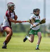 25 June 2022; Emer Kearney of Swatragh, Derry, in action against Laoise McCollam of Ruairí Óg Cushendall, Antrim, during the John West Féile na nGael National Camogie and Hurling Finals at Kiltale GAA in Meath. Photo by Daire Brennan/Sportsfile