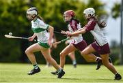 25 June 2022; Eimear Murray of Swatragh, Derry, in action against Eva McNeill of Ruairí Óg Cushendall, Antrim, during the John West Féile na nGael National Camogie and Hurling Finals at Kiltale GAA in Meath. Photo by Daire Brennan/Sportsfile