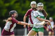 25 June 2022; Eimear Murray of Swatragh, Derry, in action against Laura Black of Ruairí Óg Cushendall, Antrim, during the John West Féile na nGael National Camogie and Hurling Finals at Kiltale GAA in Meath. Photo by Daire Brennan/Sportsfile