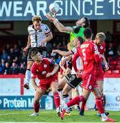 24 June 2022; Shelbourne goalkeeper Brendan Clarke claims the ball under pressure from Greg Sloggett of Dundalk during the SSE Airtricity League Premier Division match between Shelbourne and Dundalk at Tolka Park in Dublin. Photo by Michael P Ryan/Sportsfile