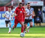 24 June 2022; Brian McManus of Shelbourne in action against Robbie Benson of Dundalk during the SSE Airtricity League Premier Division match between Shelbourne and Dundalk at Tolka Park in Dublin. Photo by Michael P Ryan/Sportsfile