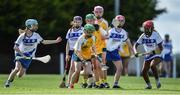 25 June 2022; Anna Carson of Naomh Bríd, Armagh, in action against Ellie Gillan, left, and Stephanie Dumevi of Tramore, Waterford, during the John West Féile na nGael National Camogie and Hurling Finals at Kiltale GAA in Meath. Photo by Daire Brennan/Sportsfile