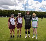 25 June 2022; Referee Shane Mooney, with captains, Laura Black, left, and Eimear Murray of Ruairí Óg Cushendall, Antrim, and Aoife McWilliams of Swatragh, Derry, during the John West Féile na nGael National Camogie and Hurling Finals at Kiltale GAA in Meath. Photo by Daire Brennan/Sportsfile