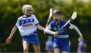 25 June 2022; Lily Marie Dolan of Tullamore, Offaly in action against Frances McCann of Tramore, Waterford, during the John West Féile na nGael National Camogie and Hurling Finals at Kiltale GAA in Meath. Photo by Daire Brennan/Sportsfile