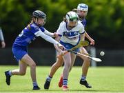 25 June 2022; Andrea Dooly of Tramore, Waterford, in action against Lily Marie Dolan of Tullamore, Offaly, during the John West Féile na nGael National Camogie and Hurling Finals at Kiltale GAA in Meath. Photo by Daire Brennan/Sportsfile