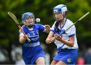 25 June 2022; Kim McGrath of Tramore, Waterford, in action against Ellie Lalor of Tullamore, Offaly, during the John West Féile na nGael National Camogie and Hurling Finals at Kiltale GAA in Meath. Photo by Daire Brennan/Sportsfile