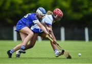 25 June 2022; Stephanie Dumevi of Tramore, Waterford, in action against Anna Maunsell of Tullamore, Offaly, during the John West Féile na nGael National Camogie and Hurling Finals at Kiltale GAA in Meath. Photo by Daire Brennan/Sportsfile