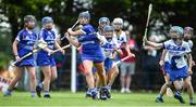 25 June 2022; Sarah O'Rourke of Tullamore, Offaly, in action against Caitlin Lowry of Tramore, Waterford, during the John West Féile na nGael National Camogie and Hurling Finals at Kiltale GAA in Meath. Photo by Daire Brennan/Sportsfile