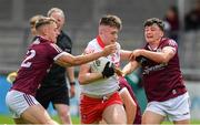 25 June 2022; Dara McPeak of Derry in action against Stephen Curley, left, and Tomás Farting of Galway during the Electric Ireland GAA All-Ireland Football Minor Championship Semi-Final match between Galway and Derry at Parnell Park, Dublin. Photo by Ray McManus/Sportsfile