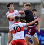 25 June 2022; Galway goalkeeper Kyle Gilmore is tackled by Conal Higgins and Johnny McGuckian of Derry, 10, during the Electric Ireland GAA All-Ireland Football Minor Championship Semi-Final match between Galway and Derry at Parnell Park, Dublin. Photo by Ray McManus/Sportsfile