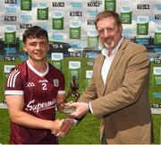 25 June 2022; Tomás Farting of Galway receiving the Electric Ireland Best & Fairest Award from Dermot McArdle, Electrick Ireland, after the Electric Ireland GAA All-Ireland Football Minor Championship Semi-Final match between Galway and Derry at Parnell Park, Dublin. Photo by Ray McManus/Sportsfile
