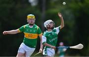 25 June 2022; Ciarán Fennessey of London in action against Cathal Malone of Castleblayney, Monaghan, during the John West Féile na nGael National Camogie and Hurling Finals at Meath GAA Centre  Dunganny in Meath. Photo by Daire Brennan/Sportsfile