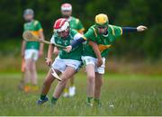 25 June 2022; Tom Duffy of Castleblayney, Monaghan in action against Rory Fennessey of London, during the John West Féile na nGael National Camogie and Hurling Finals at Meath GAA Centre  Dunganny in Meath. Photo by Daire Brennan/Sportsfile