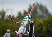 25 June 2022; Andrew O'Reilly  of St Fechin's, Louth in action against Daithí Barrett of Middletown Na Fianna, Armagh, during the John West Féile na nGael National Camogie and Hurling Finals at Meath GAA Centre  Dunganny in Meath. Photo by Daire Brennan/Sportsfile