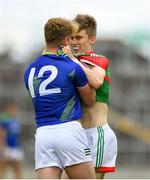 25 June 2022; John MacMonagle of Mayo grabs a hold Jack Clifford of Kerry during the Electric Ireland GAA All-Ireland Football Minor Championship Semi-Final match between Mayo and Kerry at O'Connor Park in Tullamore, Offaly. Photo by George Tewkesbury/Sportsfile