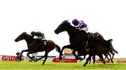 25 June 2022; Shartash, 6, with Ben Coen up, on their way to winning The GAIN Railway Stakes from second place Blackbeard with Ryan Moore during the Dubai Duty Free Irish Derby Festival at The Curragh Racecourse in Kildare. Photo by Matt Browne/Sportsfile