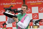 25 June 2022; Jockey Colin Keane celebrates with the trophy after winning the Dubai Duty Free Irish Derby on Westover during the Dubai Duty Free Irish Derby Festival at The Curragh Racecourse in Kildare. Photo by Matt Browne/Sportsfile