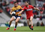 25 June 2022; Jamie Malone of Clare in action against Niall Loughlin of Derry during the GAA Football All-Ireland Senior Championship Quarter-Final match between Clare and Derry at Croke Park, Dublin. Photo by David Fitzgerald/Sportsfile