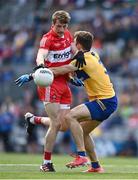 25 June 2022; Brendan Rogers of Derry in action against Cillian Brennan of Clare during the GAA Football All-Ireland Senior Championship Quarter-Final match between Clare and Derry at Croke Park, Dublin. Photo by David Fitzgerald/Sportsfile
