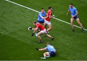 25 June 2022; Mattie Taylor of Cork breaks away from the challenge of John Small, left, and Ciarán Kilkenny of Dublin during the GAA Football All-Ireland Senior Championship Quarter-Final match between Dublin and Cork at Croke Park, Dublin. Photo by Daire Brennan/Sportsfile