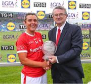 25 June 2022; Doireann O'Sullivan of Cork receives the Player of the Match award from Con Moynihan, LGFA Vice-President, following the TG4 All-Ireland SFC Group D Round 3 fixture between Cork and Waterford at MW Hire O’Moore Park in Portlaoise, Co. Laois. Photo by Michael P Ryan/Sportsfile