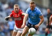 25 June 2022; Ciarán Kilkenny of Dublin in action against Mattie Taylor of Cork during the GAA Football All-Ireland Senior Championship Quarter-Final match between Dublin and Cork at Croke Park, Dublin. Photo by David Fitzgerald/Sportsfile