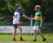 25 June 2022; Michael Dermody of New York shakes hands with Christian Traynor of Castleblayney, Monaghan, during the John West Féile na nGael National Camogie and Hurling Finals at Boardsmill GAA Club in Meath. Photo by Daire Brennan/Sportsfile