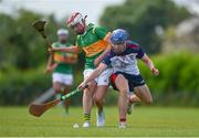 25 June 2022; Liam Spillane of New York in action against Harry McQuillan of Castleblayney, Monaghan, during the John West Féile na nGael National Camogie and Hurling Finals at Boardsmill GAA Club in Meath. Photo by Daire Brennan/Sportsfile