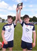 25 June 2022; New York captains Liam Spillane, left, and Cormac O'Reilly lift the Division 4 Plate Trophy during the John West Féile na nGael National Camogie and Hurling Finals at Boardsmill GAA Club in Meath. Photo by Daire Brennan/Sportsfile