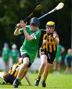 25 June 2022; Craig Russell of Seán Mac Cumhaill, Donegal, in action against Aodhan Grogan of Éire Óg, Tyrone, during the John West Féile na nGael National Camogie and Hurling Finals at Boardsmill GAA Club in Meath. Photo by Daire Brennan/Sportsfile