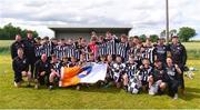 25 June 2022; Middletown Na Fianna, Armagh, players and mentors celebrate their side's win in  the Division 4 Plate Final during the John West Féile na nGael National Camogie and Hurling Finals at Boardsmill GAA Club in Meath. Photo by Daire Brennan/Sportsfile