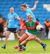 25 June 2022; Ciara Needham of Mayo in action against Jennifer Dunne of Dublin during the TG4 All-Ireland SFC Group A Round 3 match between Dublin and Mayo at MW Hire O’Moore Park in Portlaoise, Co Laois. Photo by Michael P Ryan/Sportsfile