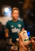 25 June 2022; Republic of Ireland's Denise O'Sullivan poses for her portrait to be sketched on a coffee cup from Kvarts Coffee in Tbilisi ahead of their FIFA Women's World Cup 2023 Qualifier match against Georgia on Monday. Photo by Stephen McCarthy/Sportsfile