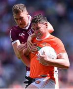 26 June 2022; Aaron McKay of Armagh in action against Robert Finnerty of Galway during the GAA Football All-Ireland Senior Championship Quarter-Final match between Armagh and Galway at Croke Park, Dublin. Photo by Piaras Ó Mídheach/Sportsfile