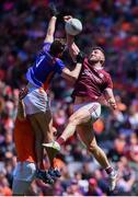 26 June 2022; Damien Comer of Galway punches wide under pressure from Armagh goalkeeper Ethan Rafferty during the GAA Football All-Ireland Senior Championship Quarter-Final match between Armagh and Galway at Croke Park, Dublin. Photo by Piaras Ó Mídheach/Sportsfile