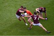 26 June 2022; Jarly Óg Burns of Armagh in action against Galway players, left to right, Paul Conroy, Kieran Molloy and Damien Comer during the GAA Football All-Ireland Senior Championship Quarter-Final match between Armagh and Galway at Croke Park, Dublin. Photo by Daire Brennan/Sportsfile