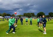 26 June 2022; The Ireland team warm-up before the LevelUp11 First Men's T20 International match between Ireland and India at Malahide Cricket Club in Dublin. Photo by Ramsey Cardy/Sportsfile