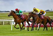 26 June 2022; La Petite Coco, with Billy Lee up, left, race up the home straight alongside My Astra, with Daniel Tudhope up, on their way to winning the Alwasmiyah Pretty Polly Stakes during day three of the Dubai Duty Free Irish Derby Festival at The Curragh Racecourse in Kildare. Photo by David Fitzgerald/Sportsfile