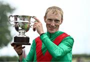 26 June 2022; Jockey Billy Lee celebrates with the cup after winning the Alwasmiyah Pretty Polly Stakes on La Petite Coco during day three of the Dubai Duty Free Irish Derby Festival at The Curragh Racecourse in Kildare. Photo by David Fitzgerald/Sportsfile