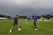 26 June 2022; Umran Malik, left, and Avesh Khan of India during a rain delay at the LevelUp11 First Men's T20 International match between Ireland and India at Malahide Cricket Club in Dublin. Photo by Ramsey Cardy/Sportsfile