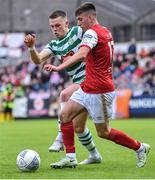 27 June 2022; Darragh Burns of St Patrick's Athletic is tackled by Andy Lyons of Shamrock Rovers during the SSE Airtricity League Premier Division match between St Patrick's Athletic and Shamrock Rovers at Richmond Park in Dublin. Photo by Piaras Ó Mídheach/Sportsfile