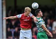 27 June 2022; Tom Grivosti of St Patrick's Athletic in action against Aaron Greene of Shamrock Rovers during the SSE Airtricity League Premier Division match between St Patrick's Athletic and Shamrock Rovers at Richmond Park in Dublin. Photo by Piaras Ó Mídheach/Sportsfile