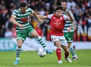 27 June 2022; Aaron Greene of Shamrock Rovers in action against Adam O'Reilly of St Patrick's Athletic during the SSE Airtricity League Premier Division match between St Patrick's Athletic and Shamrock Rovers at Richmond Park in Dublin. Photo by Piaras Ó Mídheach/Sportsfile