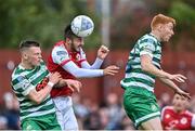 27 June 2022; Jack Scott of St Patrick's Athletic beats Andy Lyons, left, and Rory Gaffney of Shamrock Rovers to the header during the SSE Airtricity League Premier Division match between St Patrick's Athletic and Shamrock Rovers at Richmond Park in Dublin. Photo by Piaras Ó Mídheach/Sportsfile