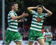 27 June 2022; Aaron Greene of Shamrock Rovers celebrates towards the St Patrick's Athletic supporters after scoring his side's second goal with team mate Gary O'Neill reacting during the SSE Airtricity League Premier Division match between St Patrick's Athletic and Shamrock Rovers at Richmond Park in Dublin. Photo by George Tewkesbury/Sportsfile