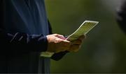 28 June 2022; A caddy consults his yardage book during a practice round in advance of the Horizon Irish Open Golf Championship at Mount Juliet Golf Club in Thomastown, Kilkenny. Photo by Eóin Noonan/Sportsfile