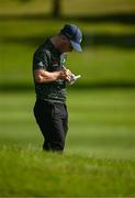 28 June 2022; Brendan Lawlor of Ireland consults his yardage book on the 9th fairway during the G4D Tour Horizon Irish Open 2022 at Mount Juliet Golf Club in Thomastown, Kilkenny. Photo by Eóin Noonan/Sportsfile