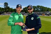 28 June 2022; Craig Young of Ireland, left, presented with his 50th T20 International cap by Ireland captain Andrew Balbirnie during the LevelUp11 Second Men's T20 International match between Ireland and India at Malahide Cricket Club in Dublin. Photo by Sam Barnes/Sportsfile